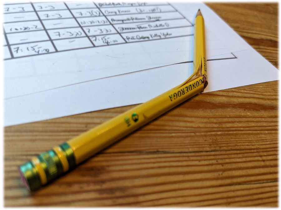 Picture of a handwritten schedule with items crossed-out and rewritten, and a pencil broken out of frustration.