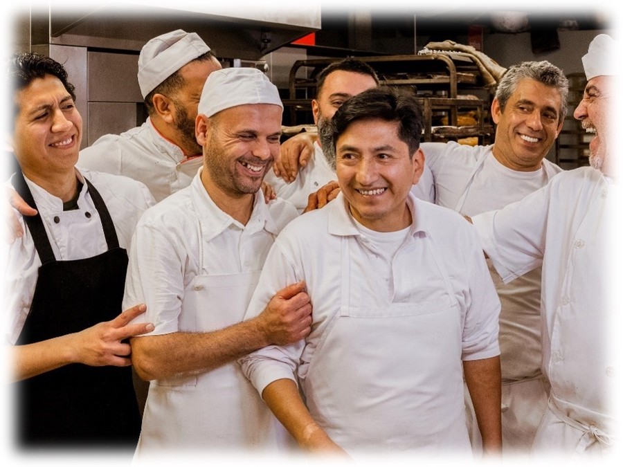 A team of restaurant staff members enjoying a moment of camaraderie.