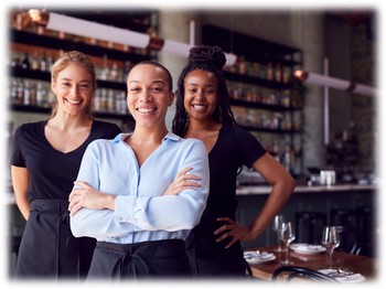 A proud business owner and two happy employees